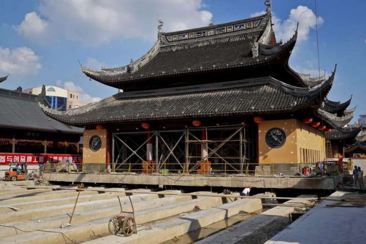 The main hall of Shanghais famed Jade Buddha Temple needs to be moved 30.66 meters to the north. From nationmultimedia.com