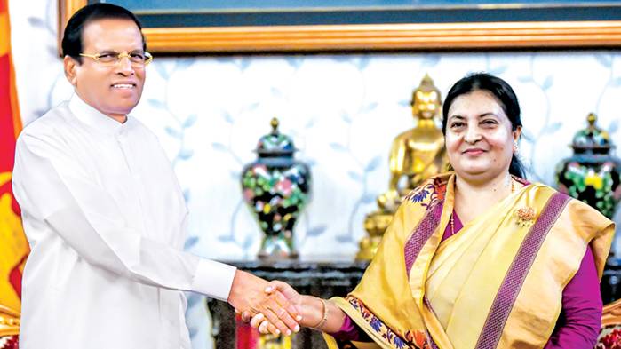 President Maithripala Sirisena who visited Nepal to attend the BIMSTEC Summit was warmly received by Nepals President Bidhya Devi Bhandari when he called on her at her official residence Sheetal Niwas for talks on Saturday. Picture by Sudath Silva
