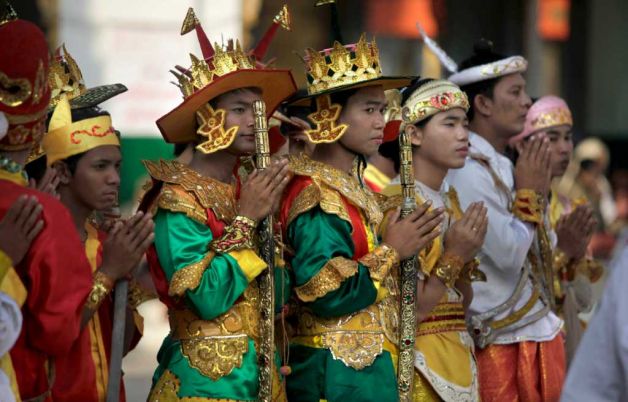 Description: Myanmar's men in ceremonial dresses pray before the 2600th anniversary celebrations of Shwedagon Pagoda in Yangon, Myanmar, Wednesday, Feb. 22, 2012. Photo: Altaf Qadri /
 AP