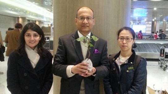 Description: India's Ambassador to South Korea Vishnu Prakash (centre) holding the sacred sapling from India's Bodhi Tree. | IANS