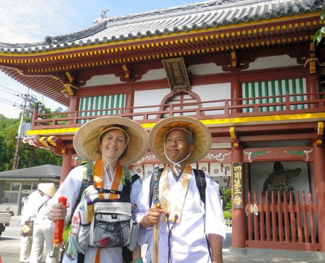 Description: In traditional pilgrim attire, Marie-Edith Laval of France is seen in Naruto, Tokushima Prefecture, with Harunori Shishido, head of the secretariat of Henro to Omotenashi no Network in Takamatsu, Kagawa Prefecture, in July 2013. (Provided by Harunori Shishido) 