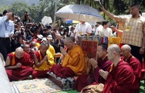 Exiled Tibetan spiritual leader, the Dalai Lama, prays for the victims of Typhoon Morakot who died during a landslide in Hsiaolin village, Pingtung County, southern Taiwan August 31, 2009. (Reuters)