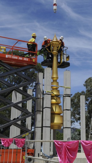 The umbrella is screwed on to the spire.