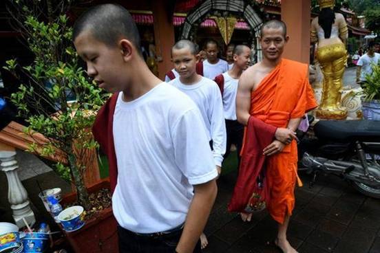 Coach Ekkapol Chantawong remained in the temple as the boys left