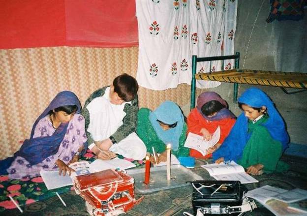 Children in Afghanistan study by the light of the donated temple candles. From candle-night.org