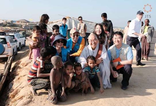 Venerable Pomnyun Sunim with JTS President Gena Park, and JTS Goodwill Ambassadors screenwriter Noh Hee-kyung and actor Jo In-sung at the refugee camp in Bangladesh. Image courtesy of JTS