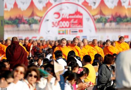 Description: The monks meditated, prayed and collected alms in an event meant to tighten the relationship of monks and Buddhists between Thailand and Myanmar