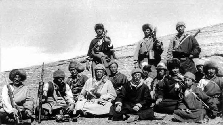 Description: The Dalai Lama during his escape to India with Khampa Chushi Gangdruk bodyguards.